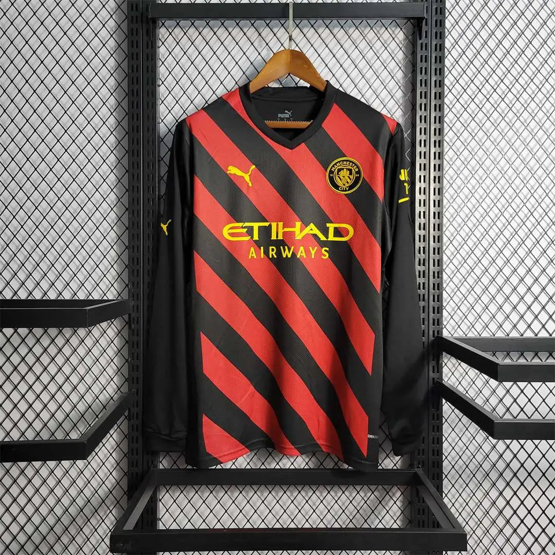 MAILLOT MANCHESTER CITY EXTÉRIEUR 2022/2023 VERSION MANCHES LONGUES - Maillot du Monde