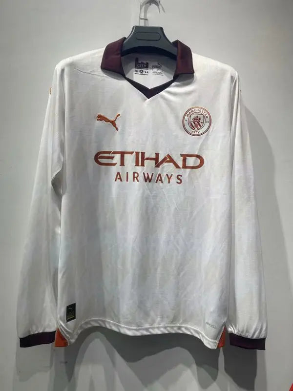 MAILLOT MANCHESTER CITY EXTÉRIEUR 2023/2024 VERSION MANCHES LONGUES - Maillot du Monde